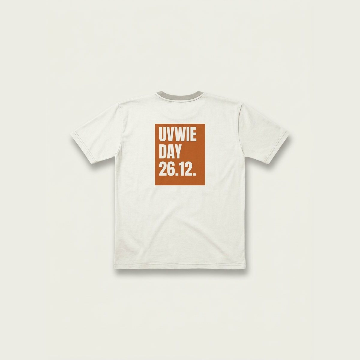 Ivory tee with a burnt orange box printed UVWIE DAY 26.12.