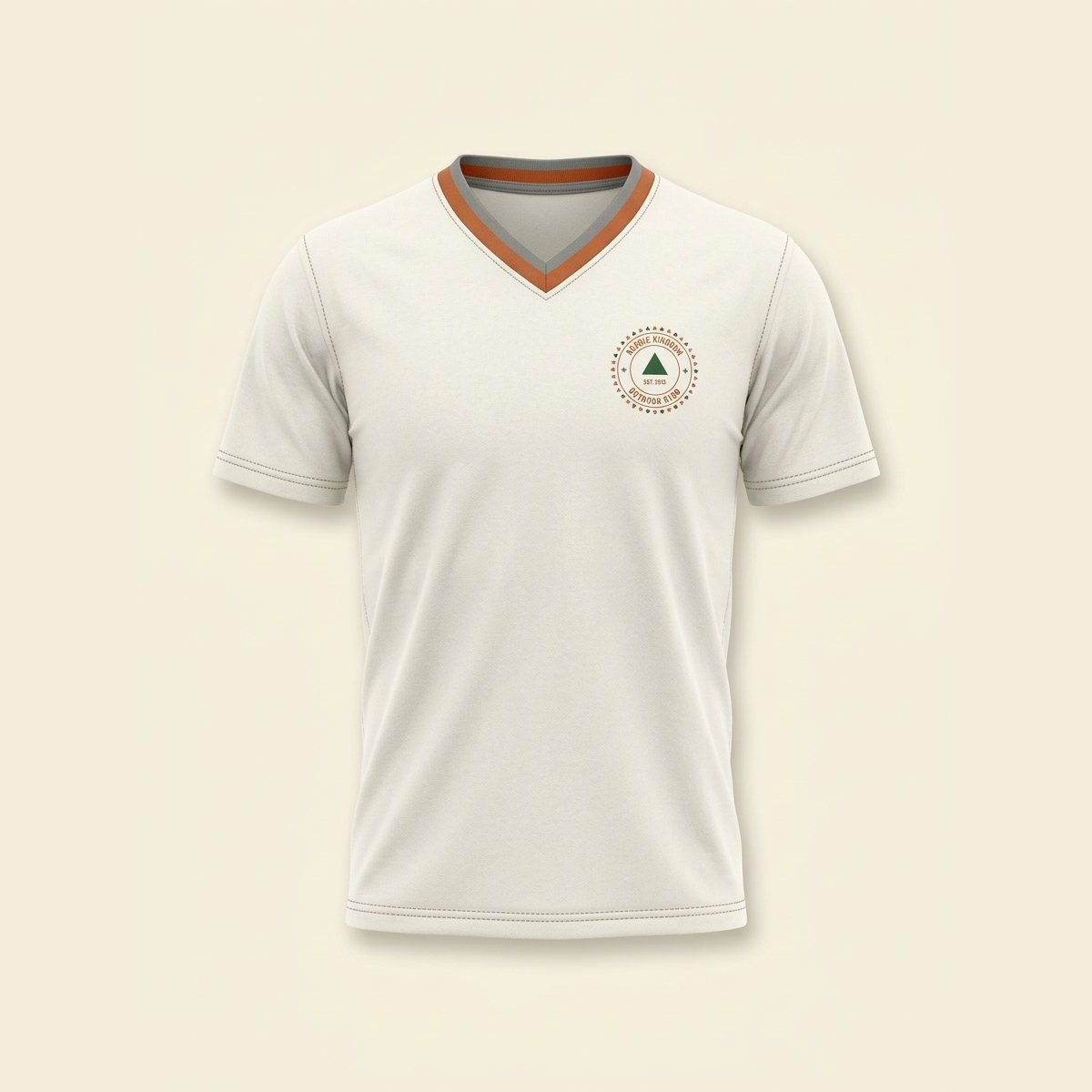 Ivory V-neck jersey with burnt orange binding and a crest on the chest.