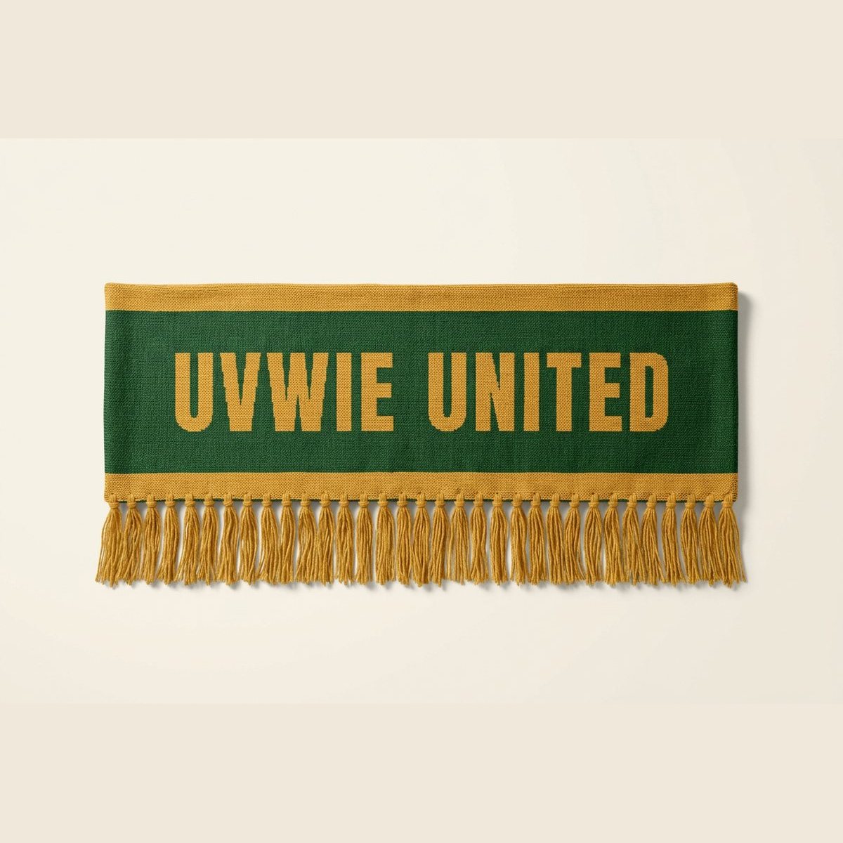 A forest green knitted scarf reading UVWIE UNITED in gold, with gold fringe.