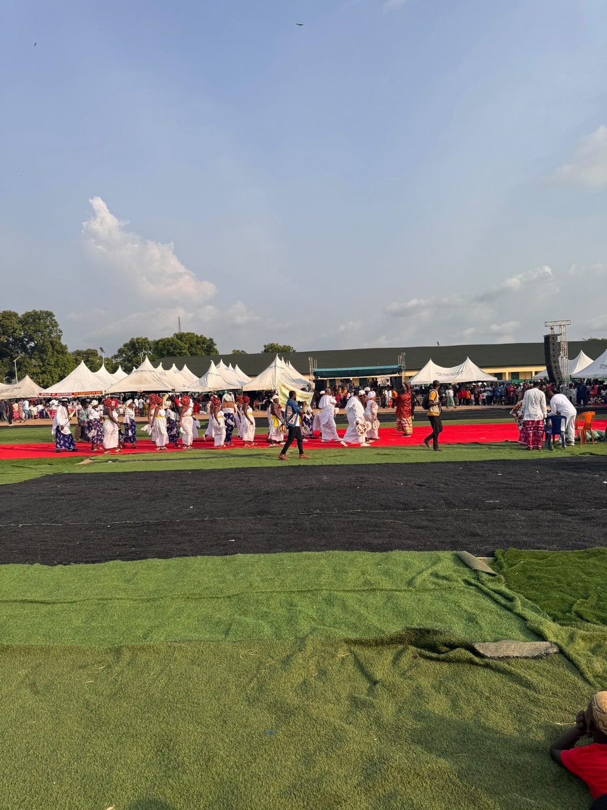 Women processing along the red carpet.